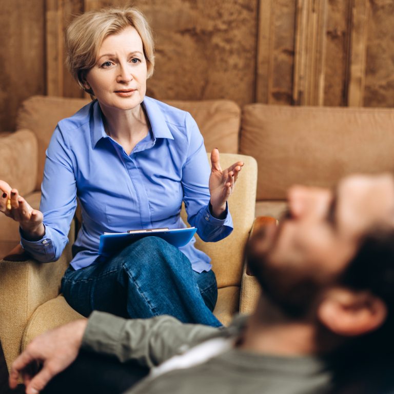 Professional female psychologist doctor consultation in a psychotherapeutic session or consultation for male patient. Help of a psychologist