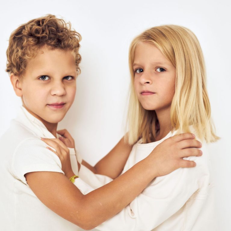 Image of boy and girl smile posing casual wear isolated background. High quality photo